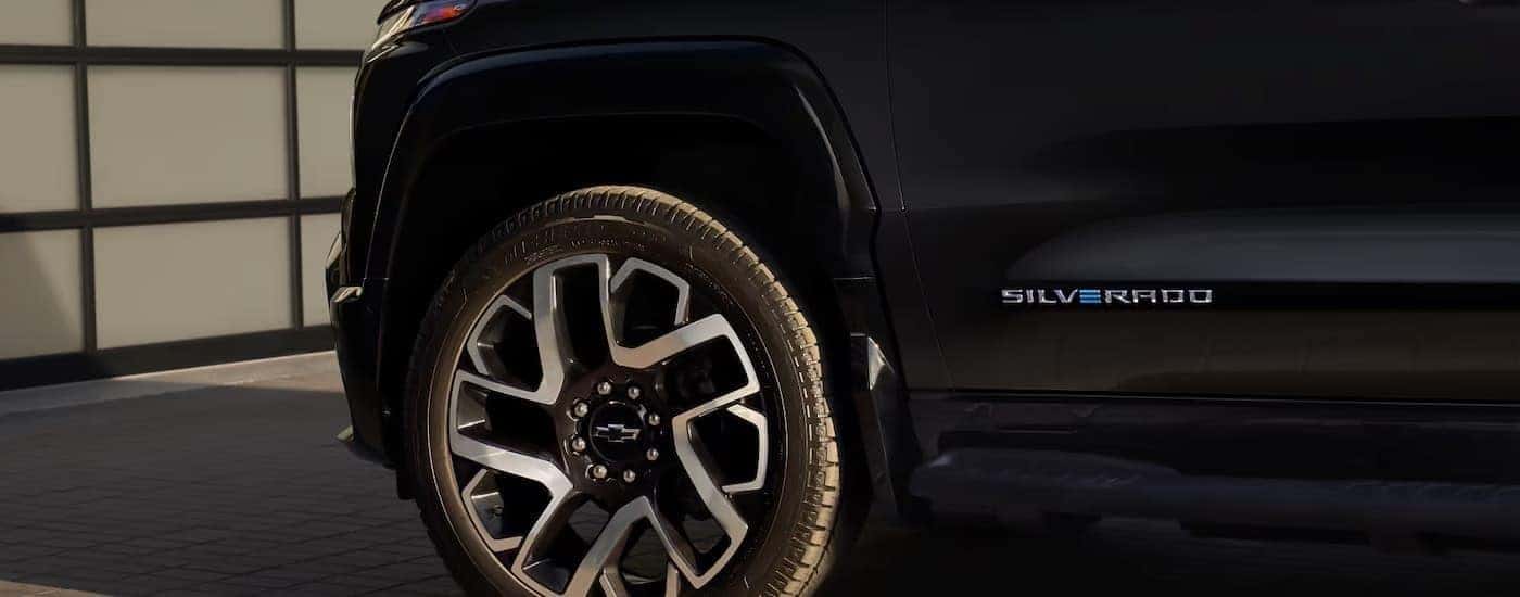 A black 2025 Chevy Silverado EV for sale near Kannapolis from the side.