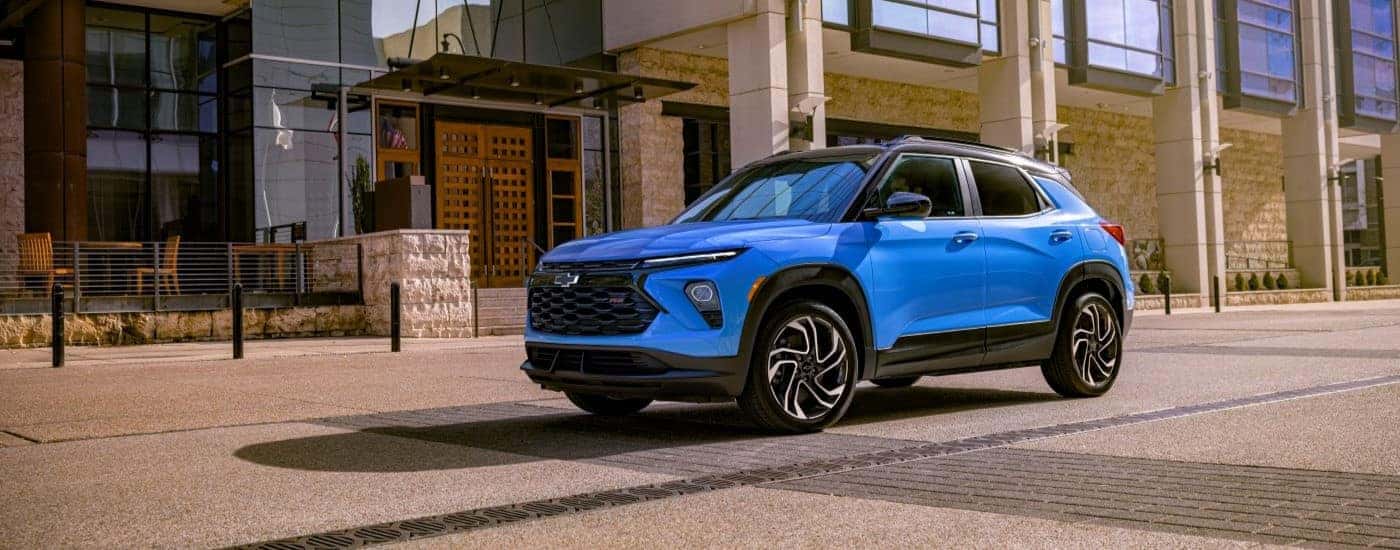 A blue used 2024 Chevy Trailblazer RS parked on a city street