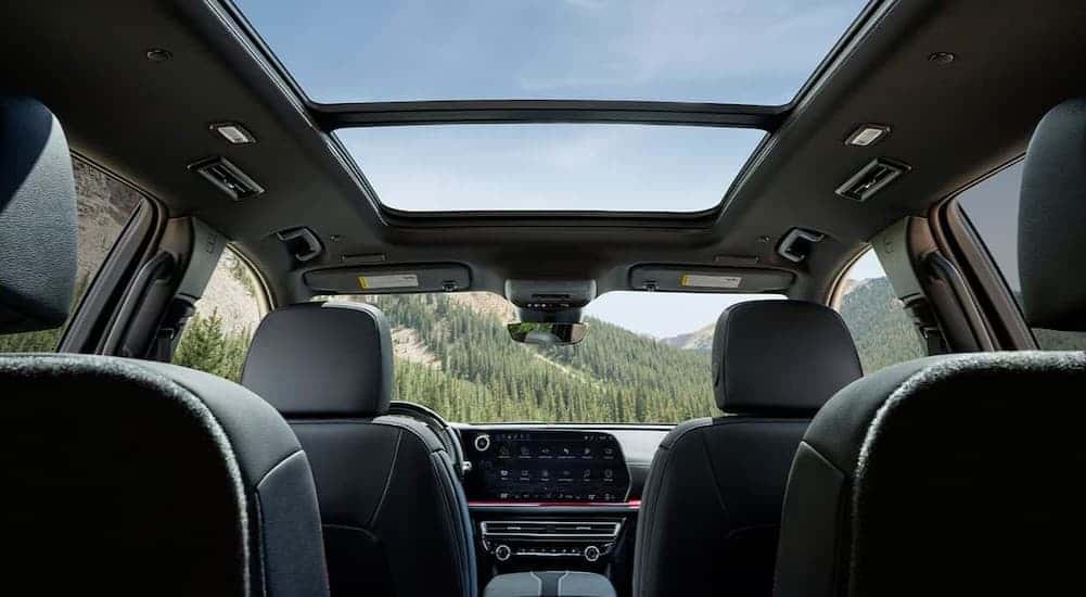 The black interior in a 2025 Chevy Traverse for sale.