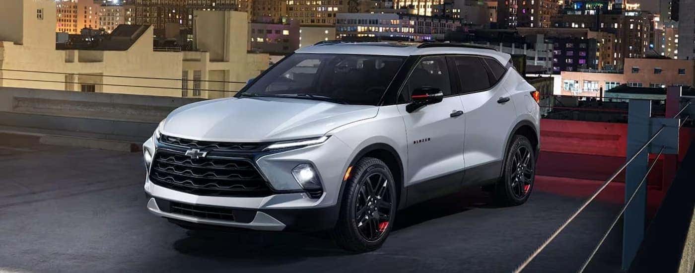 A silver 2025 Chevy Blazer parked in a city