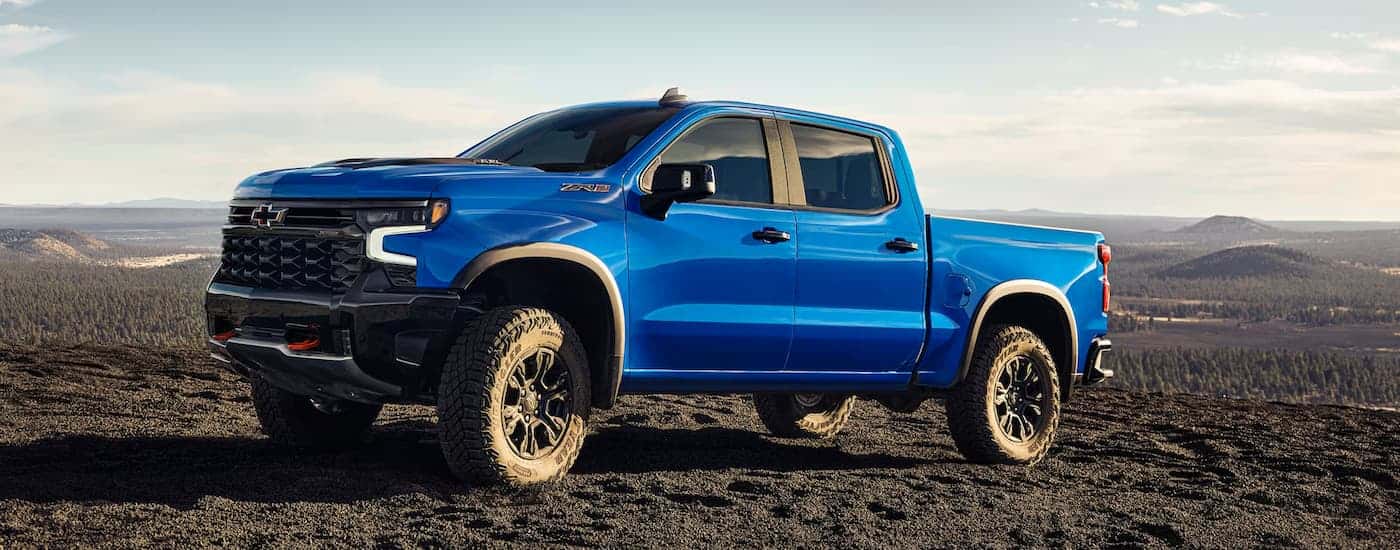 A blue 2025 Chevy Silverado 1500 ZR2 parked off-road