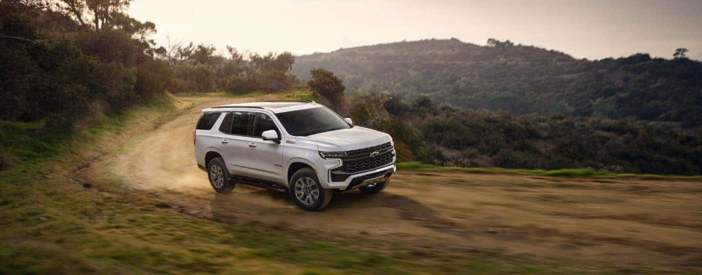 A white 2021 Chevy Tahoe from the side.