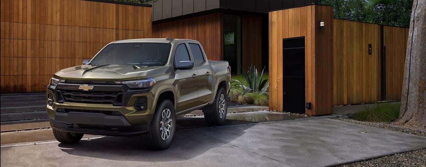A green 2025 Chevy Colorado Z71 parked on a driveway.