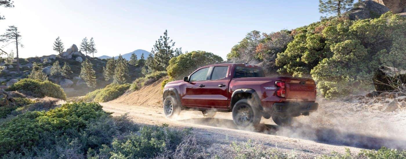 A red 2026 Chevy Colorado from the side.