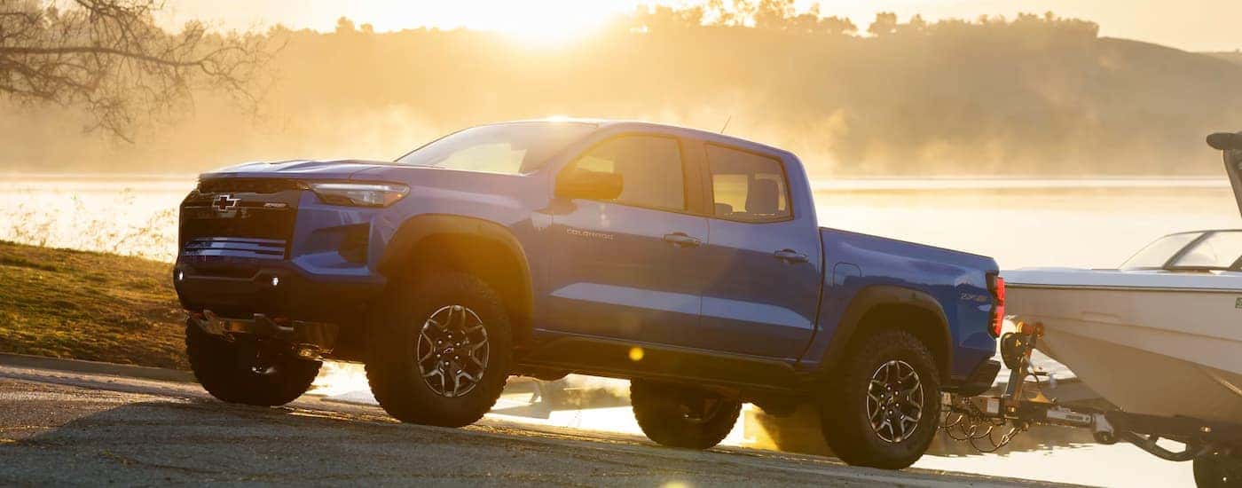 A blue 2026 Chevy Colorado ZR2 towing a boat out of water