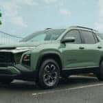Green 2026 Chevy Equinox ACTIV parked near a bridge