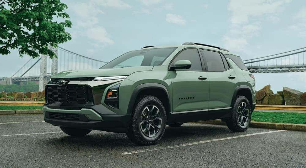 Green 2026 Chevy Equinox ACTIV parked near a bridge