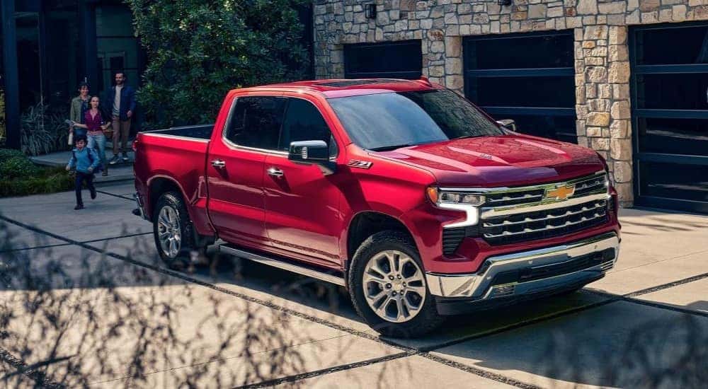 Red 2026 Chevy Silverado 1500 LTZ parked on a driveway