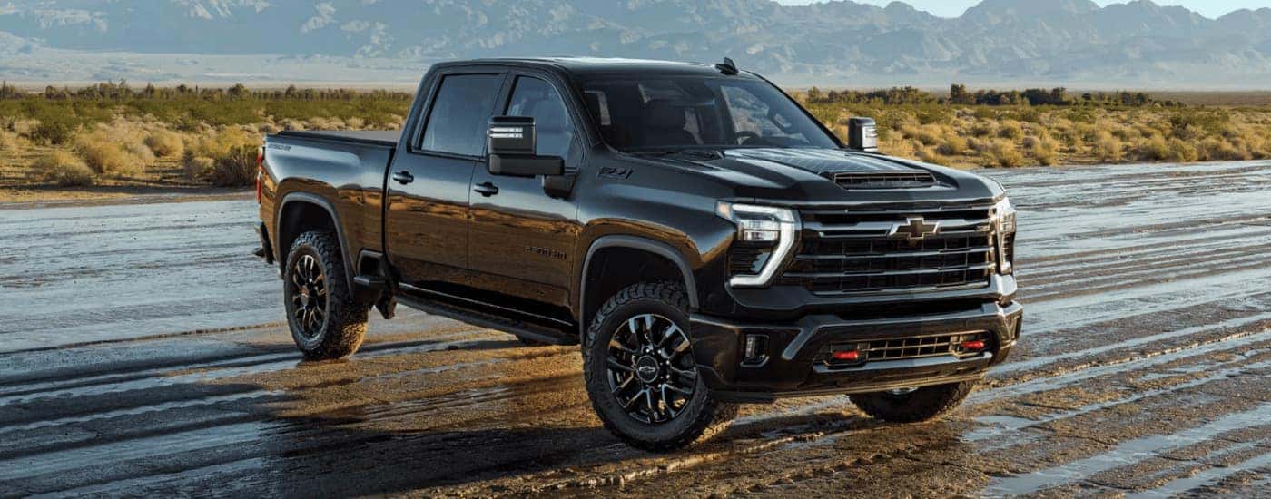 Black 2026 Chevy Silverado 2500 HD Z71 parked on mud