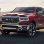 Red RAM 1500 on a dusty southwestern ranch