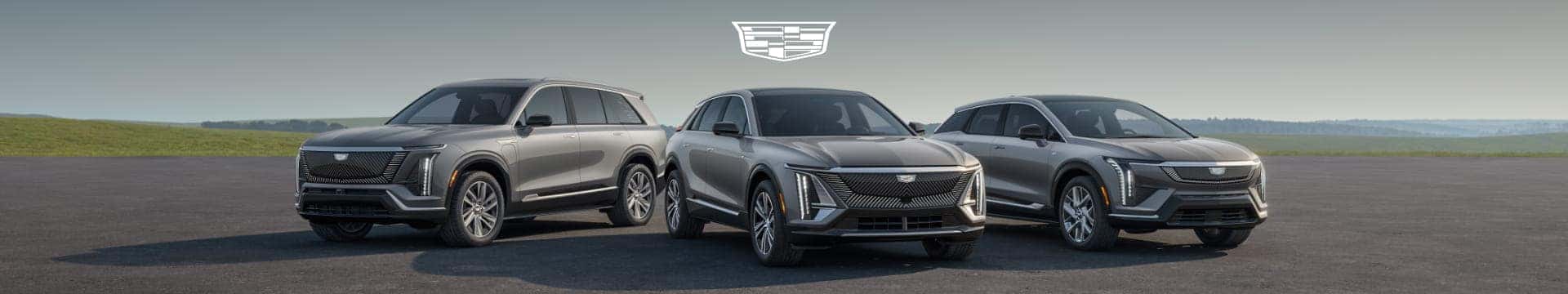 Three Cadillac SUVs displayed side by side beneath the Cadillac logo.
