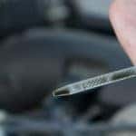 Checking oil level on dipstick