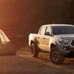 2019 Toyota Tacoma parked next to camping tent