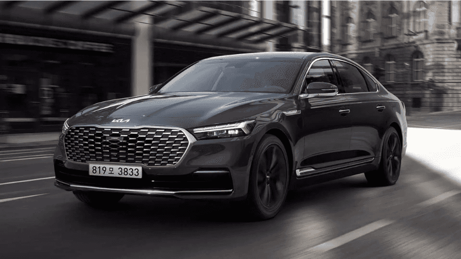 black luxury car driving on a city road