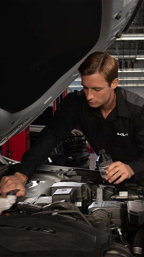 Technician working on vehicle