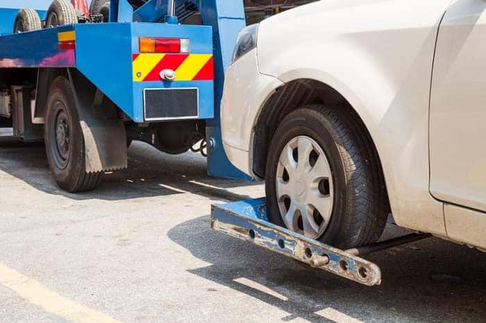 Tow truck towing car