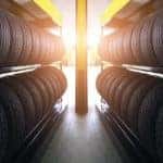 Four rows of tires are waiting to be sold at Chicagoland tire shop.