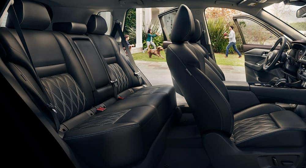 The interior of a 2021 Nisan Rogue shows two rows of seating.