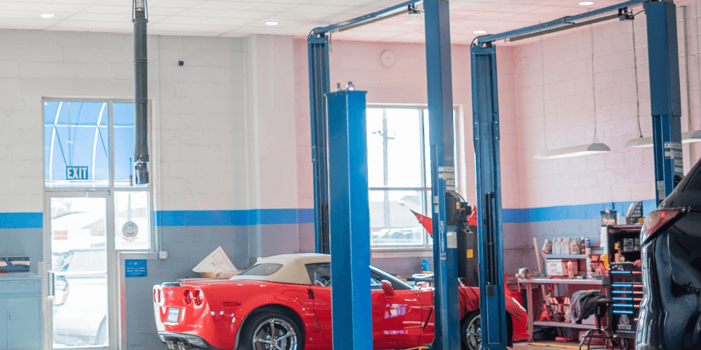 A service bay at Yoder Chevrolet in Fort Lupton, Colorado, with a vehicle on the lift