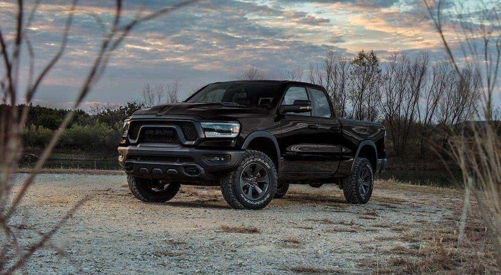 A black 2020 Ram 1500 Rebel is parked next to a pond near Florence, KY.