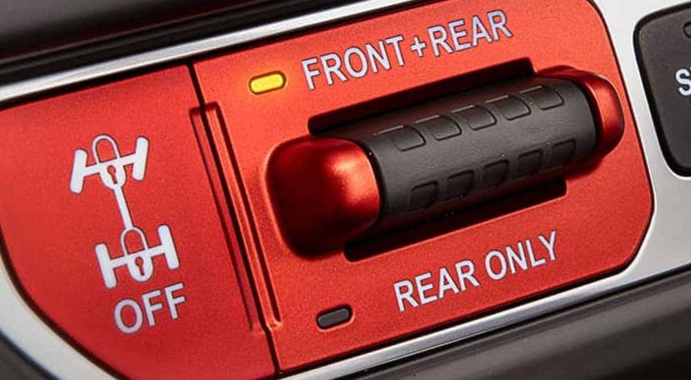 The red differential locking sitch is shown in a 2021 Jeep Wrangler that you could find at a Jeep dealer near me in Florence, KY.