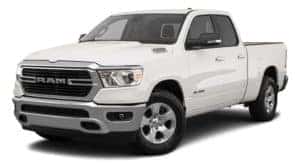 A white 2021 Ram 1500 is angled left.