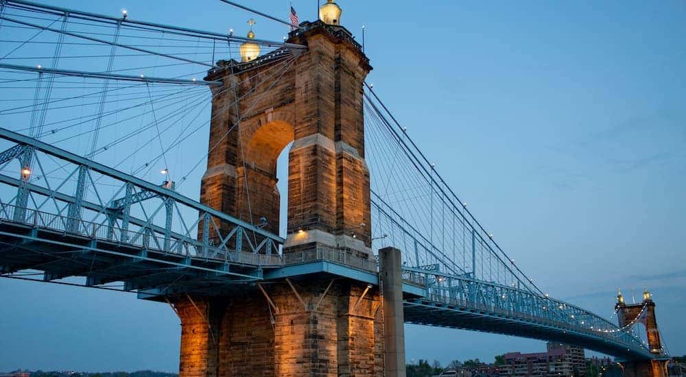 A low view is showing a bridge over a river.
