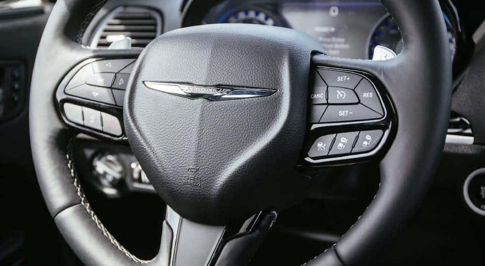 The close up of a 2021 Chrysler 300 shows the steering wheel after leaving a Cincinnati Chrysler dealership.