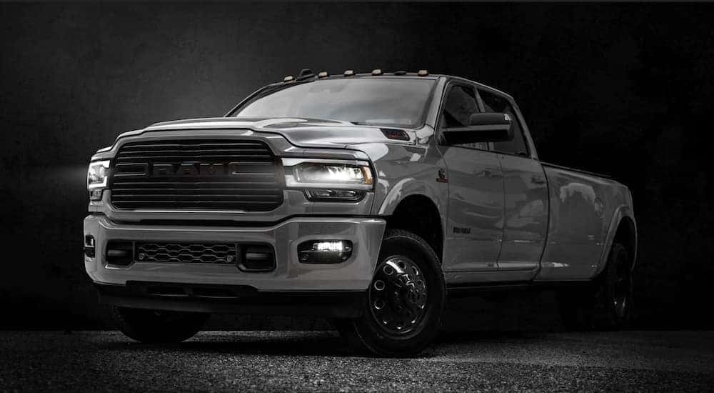 A silver 2020 Ram 3500 Night Edition is shown after leaving a pre-owned Ram dealership.