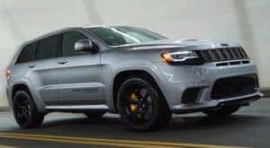 A silver 2021 Jeep Grand Cherokee Trackhawk is shown after leaving a Jeep Grand Cherokee dealer.