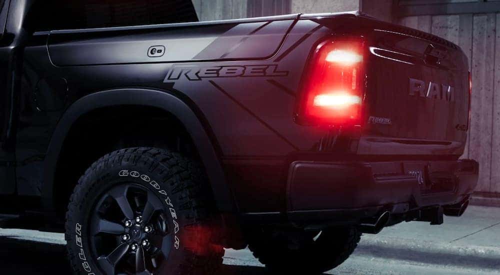 The bed and driver taillight is shown on a black 2020 Ram 1500 Rebel after leaving a Ram dealer in Cincinnati.