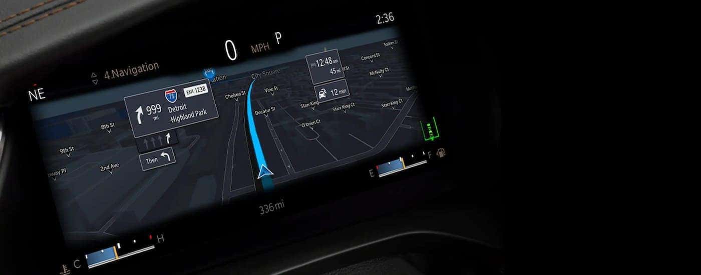 A close up shows navigation on the infotainment screen in a 2021 Jeep Grand Cherokee L.