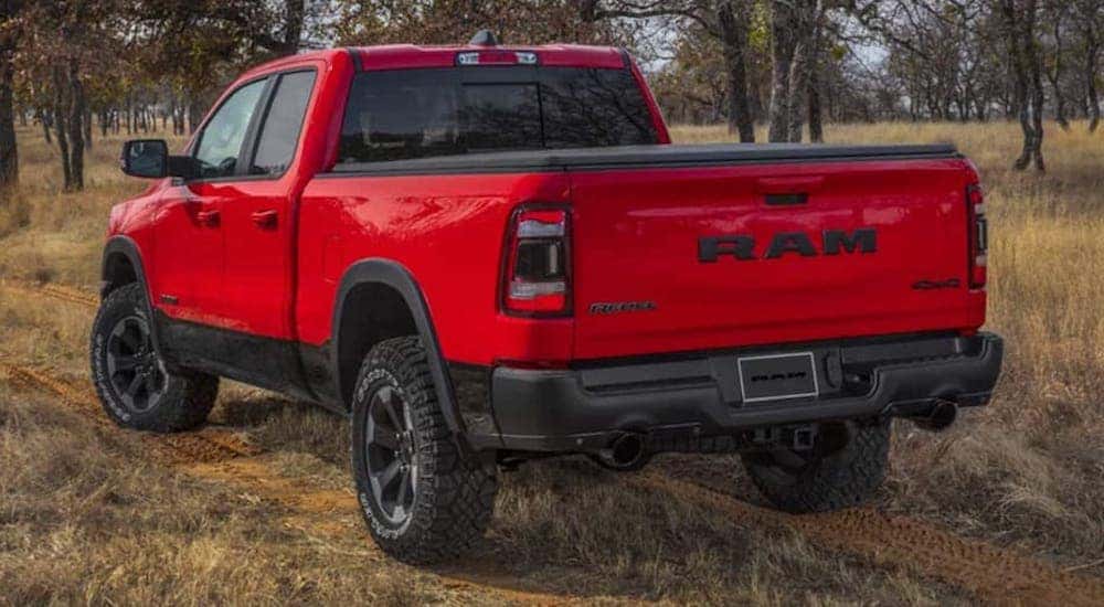 A red 2022 Ram 1500 Rebel is shown from the rear at an angle after leaving a Cincinnati Ram dealer.