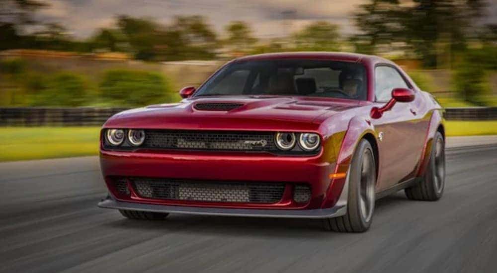 A red 2018 Dodge Challenger Hellcat is shown from the frot at an angle after the driver searched 'sell my car'.