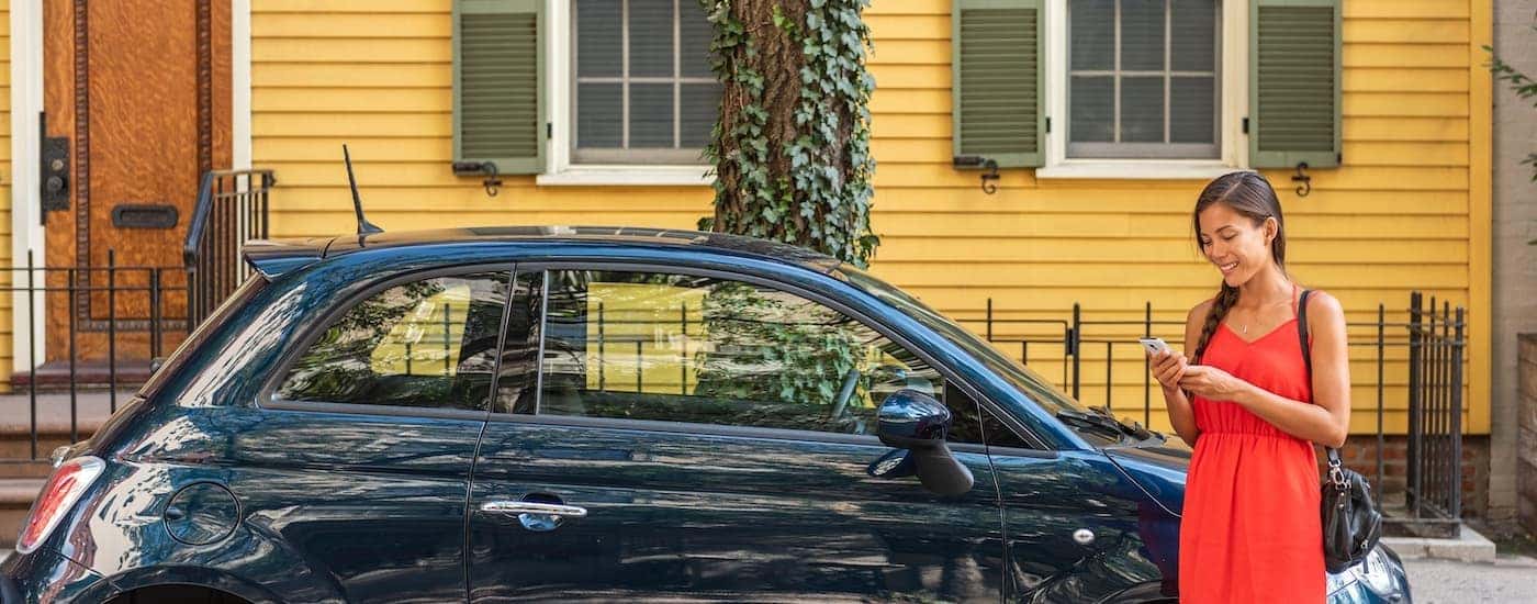 A person is shown standing in front of a car after searching 'sell my car.'