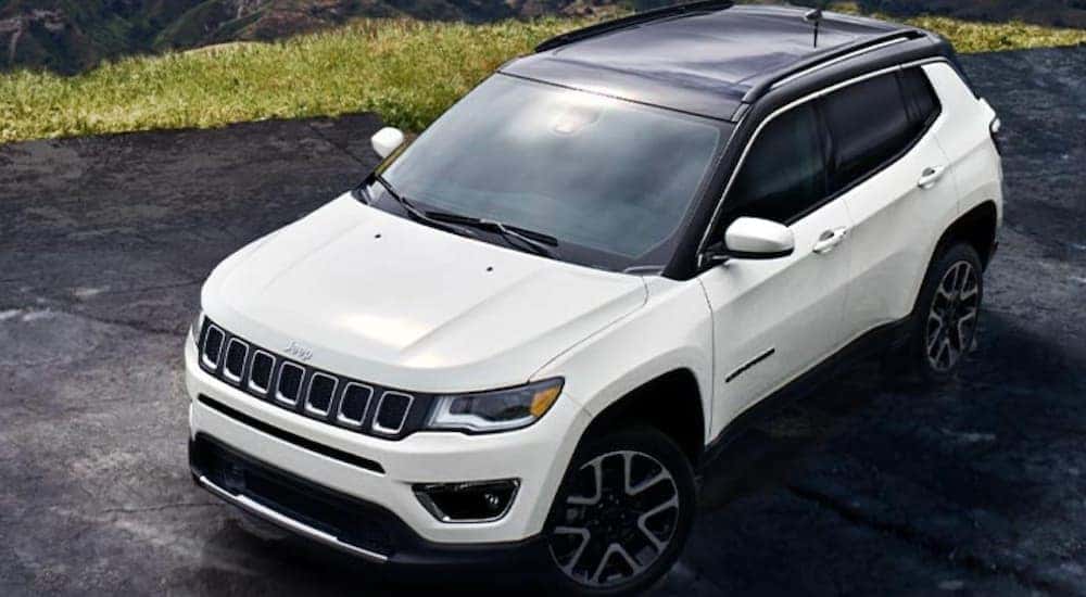 A white 2022 Jeep Compass is shown from a high angle.