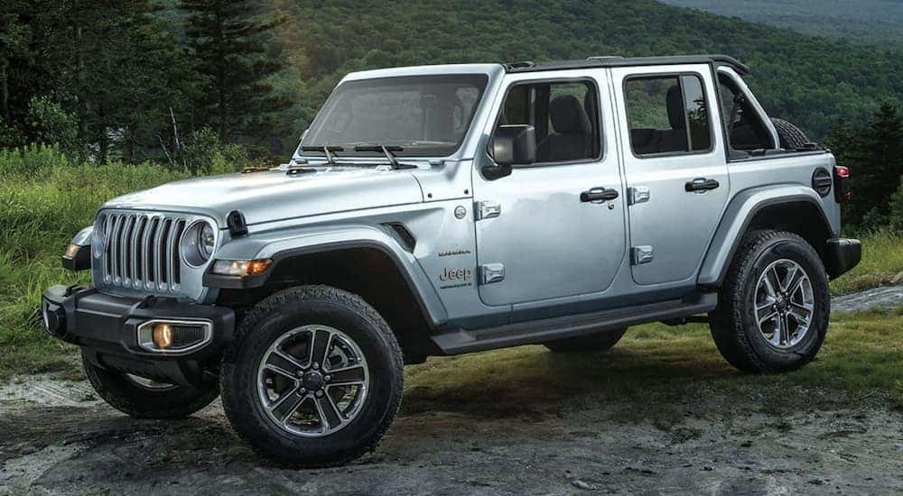 A silver 2023 Jeep Wrangler Unlimited Sahara is shown parked after leaving a Jeep Wrangler dealer.