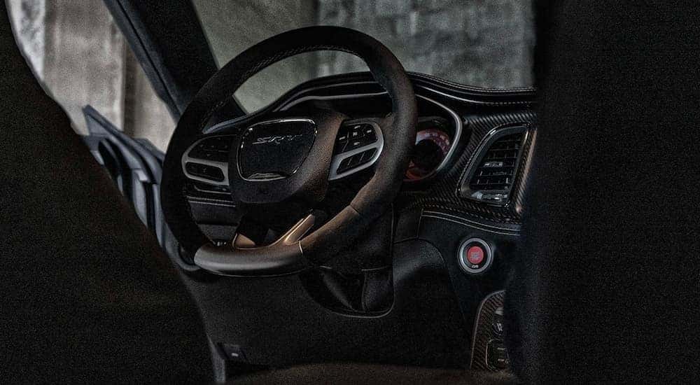 The black interior and dash is shown in a 2023 Dodge Challenger SRT Hellcat Redeye.