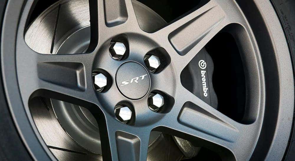 A close up shows the graphite wheel on a 2023 Dodge Challenger SRT.
