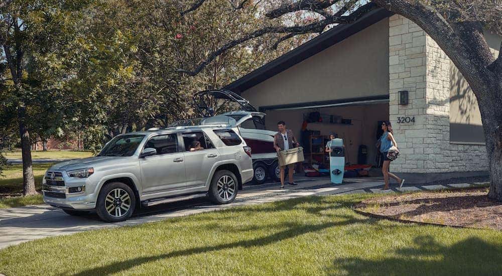 A silver 2020 Toyota 4Runner is shown parked on a driveway.