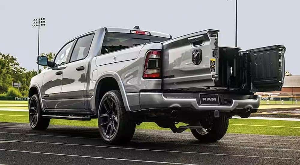 The rear end of a silver 2023 Ram 1500 for sale is shown.