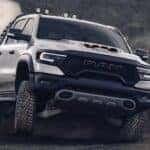 A white 2023 Ram 1500 TRX is shown off-roading after visiting Ram trucks for sale near Cincinnati.