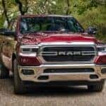 A red 2021 Ram 1500 is shown driving on a rocky road after I tried to sell my car.