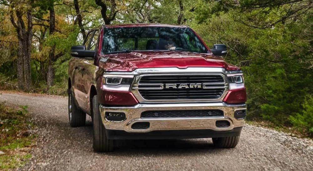 A red 2021 Ram 1500 is shown driving on a rocky road after I tried to sell my car.