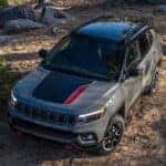 A grey 2024 Jeep Compass is shown from the front at an angle.