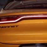 The rear of a yellow 2024 Dodge Hornet is shown in close-up after leaving a dealer that has a Dodge Hornet for sale.