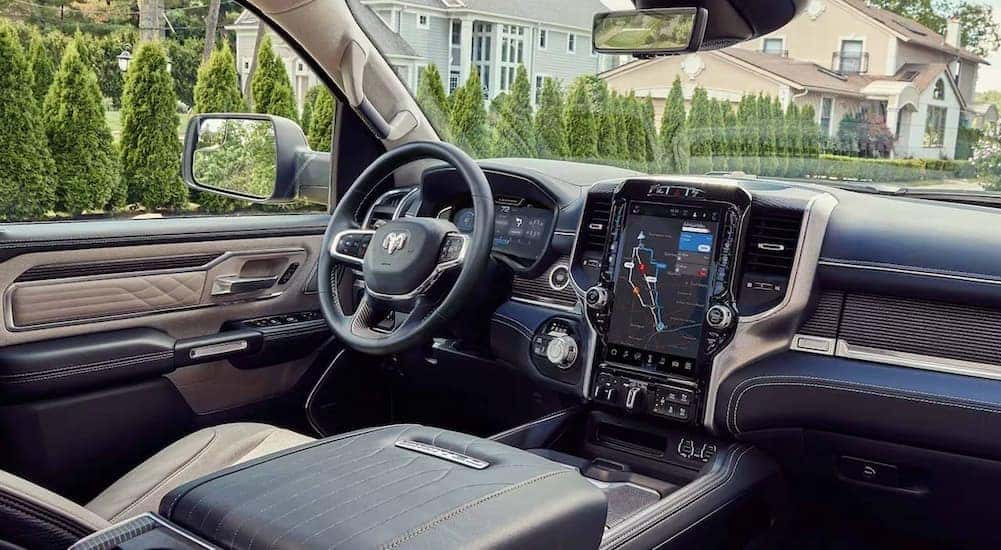 The gray interior and dash of a 2024 Ram 1500 Limited is shown.