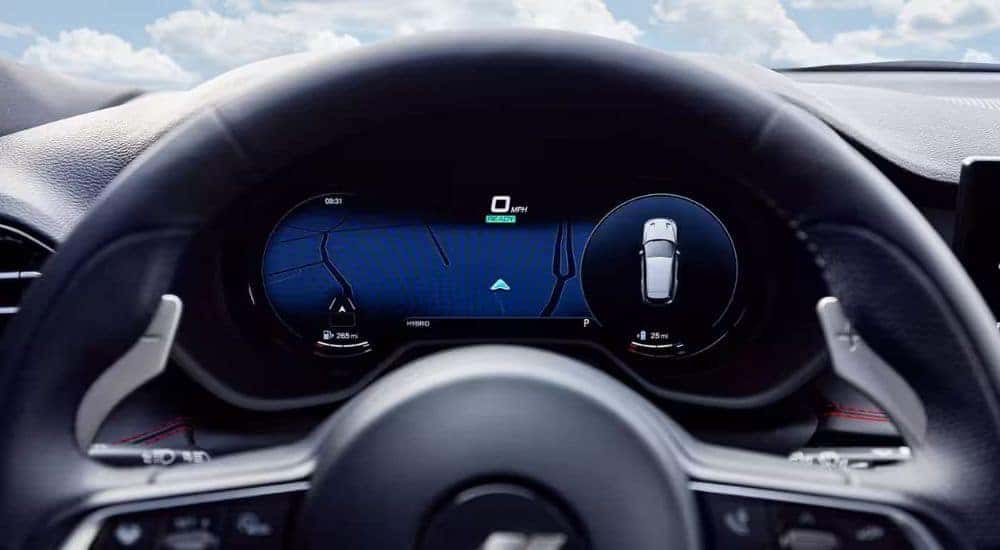 A close up shows a digital gauge in a 2024 Dodge Hornet after leaving a Dodge dealer.