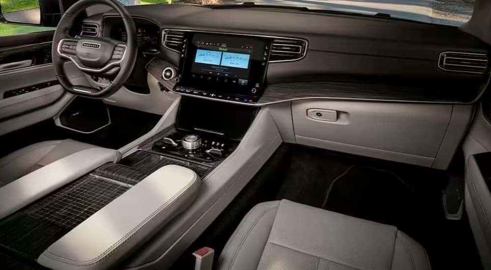 The gray and black interior and dash in a 2024 Jeep Wagoneer is shown.