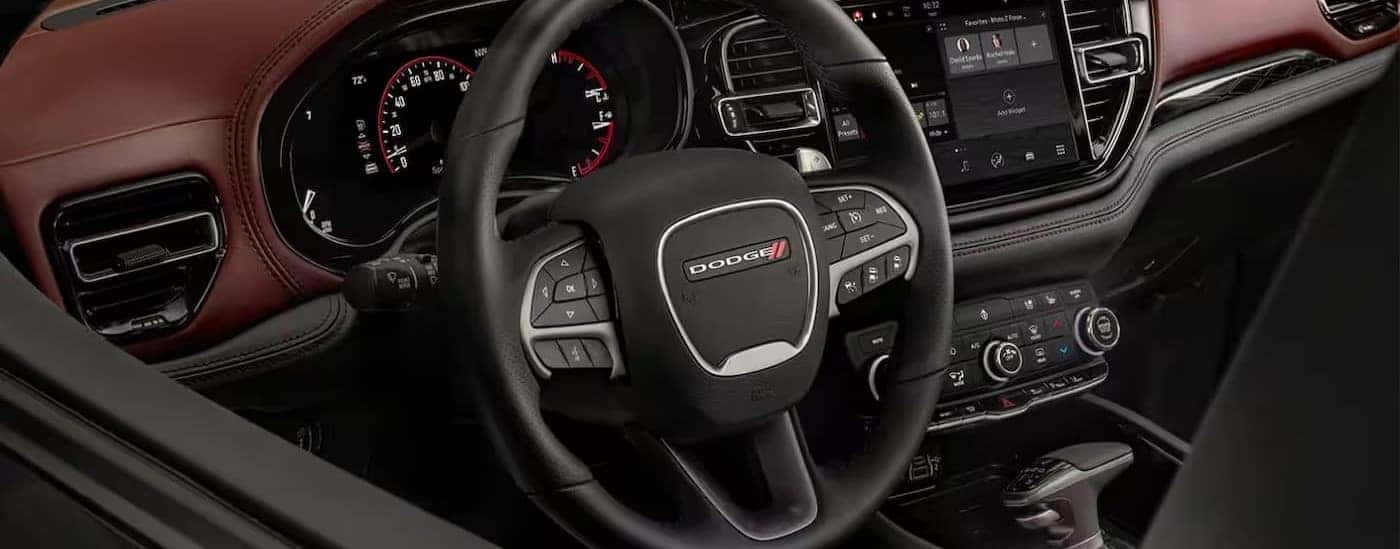 The red and black interior and dash in a 2024 Dodge Durango is shown.